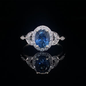 Oval Blue Sapphire and Diamond Halo Ring 14K White Gold