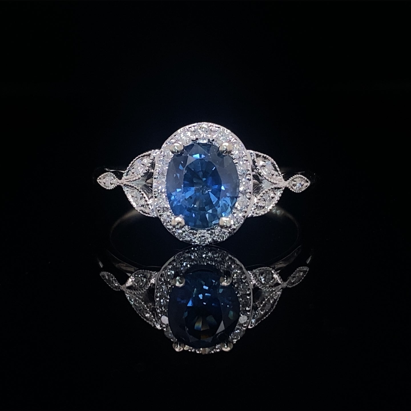 Oval Blue Sapphire and Diamond Halo Ring 14K White Gold